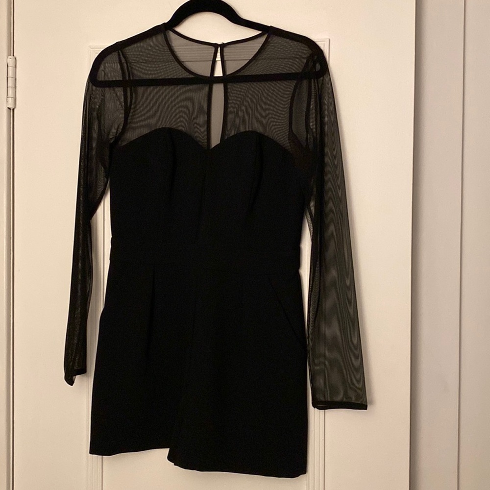 BCBGeneration black romper with mesh sleeves